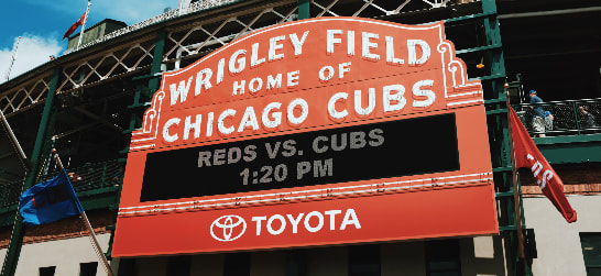 entrance sign to wrigley field reading 